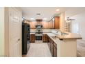 Modern kitchen features stainless steel appliances, plenty of cabinets and bar seating area at 6868 Sky Pointe Dr # 1087, Las Vegas, NV 89131