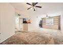 Bright living room featuring an open floorplan, ceiling fan, and lots of natural light at 6868 Sky Pointe Dr # 1087, Las Vegas, NV 89131