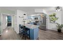Charming kitchen with blue cabinetry, stainless steel appliances, and granite countertops at 917 Boulder Springs Dr # 202, Las Vegas, NV 89128