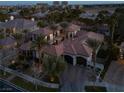 Expansive estate with lush landscaping, a private courtyard, and a multi-car garage at 9325 Canyon Classic Dr, Las Vegas, NV 89144