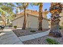 Neutral stucco apartment building featuring private entrances, desert landscaping and convenient parking at 1201 Sulphur Springs Ln # 101, Las Vegas, NV 89128