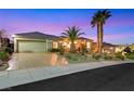 Elegant home featuring a lush, landscaped front yard and spacious garage at 2062 Dipinto Ave, Henderson, NV 89052