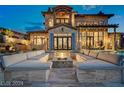 Inviting outdoor space with plush seating arranged around a fire pit, creating a cozy gathering area at 30 Via Tiberius Way, Henderson, NV 89011