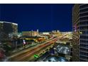 Breathtaking night view of the city with bright lights, a clear sky, and long exposure car light trails at 4471 Dean Martin Dr # 2705, Las Vegas, NV 89103