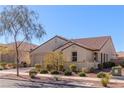 Well-maintained home with stucco exterior, tiled roof, and a neatly landscaped front yard at 472 Cadence View Way, Henderson, NV 89011