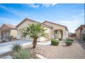 Attractive single-story home with desert landscaping including mature palm tree at 5863 Corbin Ave, Las Vegas, NV 89122