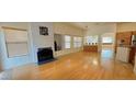 Spacious living area boasts beautiful hardwood floors, a cozy fireplace, and abundant natural light at 7858 Nookfield Dr, Las Vegas, NV 89147