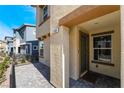 Inviting entryway with a textured wall and tiled patio at 1109 Scarlet Sparrow St, Henderson, NV 89011