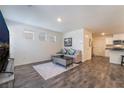 Cozy living room with hardwood floors and contemporary furnishings at 1109 Scarlet Sparrow St, Henderson, NV 89011