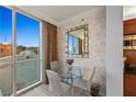 Bright breakfast nook features a clear view, modern lighting, and a modern table set at 125 E Harmon Ave # 216, Las Vegas, NV 89109