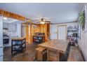 Bright kitchen features stainless appliances, gray cabinetry, and a rustic wood dining table at 1912 Margarita Ave, Henderson, NV 89011