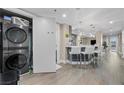 Modern kitchen with sleek appliances, white countertops, and a breakfast bar at 2700 Las Vegas Blvd # 809, Las Vegas, NV 89109