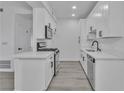 Well-lit kitchen showcasing white cabinetry, modern appliances, and sleek countertops at 3318 N Decatur Blvd # 1035, Las Vegas, NV 89130