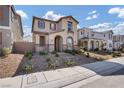 Charming two-story home featuring desert landscaping and neutral color palette at 3757 Via Gennaro, Henderson, NV 89044