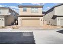 Two-car garage exterior with tile roof and desert landscaping at 3757 Via Gennaro, Henderson, NV 89044