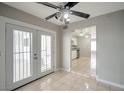 Bright dining area with tile flooring, ceiling fan and door to patio at 3966 Torsby Pl, Las Vegas, NV 89119