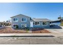 Two-story home featuring a well-manicured front yard and a long driveway at 4505 Providence Ln, Las Vegas, NV 89107