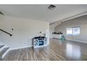 Spacious living room with wood floors, lots of light, and an open floor plan at 4505 Providence Ln, Las Vegas, NV 89107