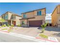 Charming exterior of a two-story home with a brick driveway and drought-resistant landscaping for easy maintenance at 7322 Glimmer Point St, North Las Vegas, NV 89084