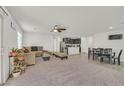 Open-concept living space with a cozy living room, dining area, and modern kitchen at 101 Deseo Ct, North Las Vegas, NV 89031