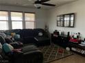 Comfortable living room featuring a plush sectional sofa, entertainment center, and neutral decor at 10355 Sipple St, Las Vegas, NV 89141