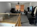 Versatile loft space with carpeting, ideal for a home office or recreation area at 10355 Sipple St, Las Vegas, NV 89141