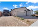 Exterior view of home with RV parking, brick-paved driveway, and low-maintenance landscaping at 181 Sierra Alta Pl, Henderson, NV 89015