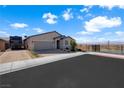 Home exterior with a view, RV parking, and drought-resistant landscaping at 181 Sierra Alta Pl, Henderson, NV 89015