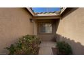 Front entryway with desert landscaping and tile roof in courtyard at 379 Rosado Springs St, Henderson, NV 89014