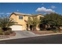 Two-story home featuring desert landscaping, a two-car garage, and a well-maintained front yard at 3938 E Chaffe Ave, Pahrump, NV 89061