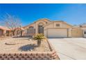 Charming single-Gathering home featuring stucco exterior and a two-car garage, complemented by mature desert landscaping at 4032 Rustic Oak Ct, North Las Vegas, NV 89032