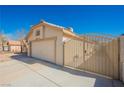 Two-car garage and private gated access to the residence at 4032 Rustic Oak Ct, North Las Vegas, NV 89032