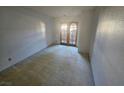 Empty carpeted bedroom featuring a light-filled room with patio access through glass paneled doors at 4055 Nook Way # A, Las Vegas, NV 89103