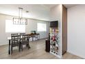 View of the Dining Room complete with modern pendant lighting at 4421 Halbert Ave, Las Vegas, NV 89110