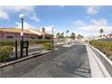 Gated community entrance providing privacy and security, surrounded by greenery at 544 Cervantes Dr, Henderson, NV 89014