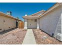 Single-story home featuring a welcoming front entry and easy-care desert landscaping at 6412 Yarmouth Dr, Las Vegas, NV 89108