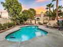 Inviting backyard pool with ample deck space for lounging and enjoying the outdoors, perfect for cooling off on hot days at 6632 Ives Ave, Las Vegas, NV 89108