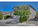 Well-maintained home boasts lush greenery, mature trees, and a spacious driveway at 7905 Brent Leaf Ave, Las Vegas, NV 89131