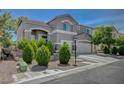 Inviting front exterior with manicured landscaping and convenient two-car garage at 7905 Brent Leaf Ave, Las Vegas, NV 89131