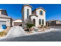 Two-story home with arched windows and desert landscaping at 9102 Brilliant Prairie Ct, Las Vegas, NV 89149