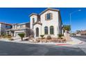 Two-story home with arched windows and desert landscaping at 9102 Brilliant Prairie Ct, Las Vegas, NV 89149