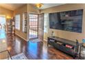 Inviting entryway with hardwood floors and lots of natural light from the windows at 951 Carnival Ave, Las Vegas, NV 89123