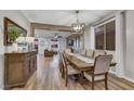 Formal dining room open to living area has wood floors and natural light at 10184 Fire Skye Ave, Las Vegas, NV 89166