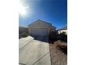 Inviting single-story home featuring a neutral color palette and low-maintenance landscaping at 1395 Kapelle St, Henderson, NV 89052