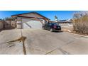 Charming single-story home with a two-car garage and long driveway on a sunny day at 2712 Rialto Rd, Las Vegas, NV 89108