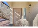 Close-up of the front door with modern hardware and nearby window at 3360 Cactus Shadow St # 102, Las Vegas, NV 89129