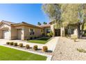 Beautifully landscaped front yard with lush green grass and stone pathway leading to the entrance at 4635 Bird View Ct, Las Vegas, NV 89129