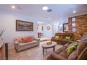 Cozy living room featuring neutral-colored walls, tile flooring, and comfortable seating at 4871 Reiter Ave, Las Vegas, NV 89108