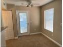 Cozy dining area with natural light, ceiling fan and access door offers comfortable and convenient meal space at 5055 W Hacienda Ave # 1028, Las Vegas, NV 89118