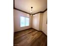 Dining room featuring laminate flooring and a modern light fixture at 5525 W Flamingo Rd # 1020, Las Vegas, NV 89103